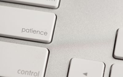 Photo of a keyboard with the word patience on one of the keys to illustrate the article How to Have More Patience.